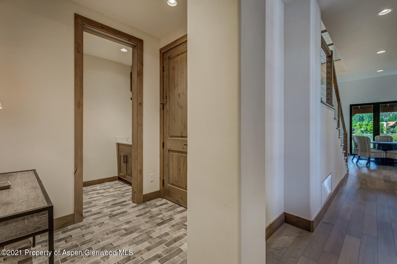471 Boundary Lane Carbondale, CO 81623 - Photo 8 of 30 a view of a hallway with bathroom and wooden floor