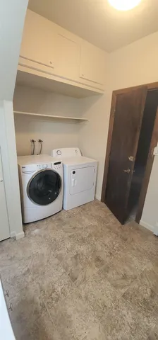 a view of a livingroom with kitchen
