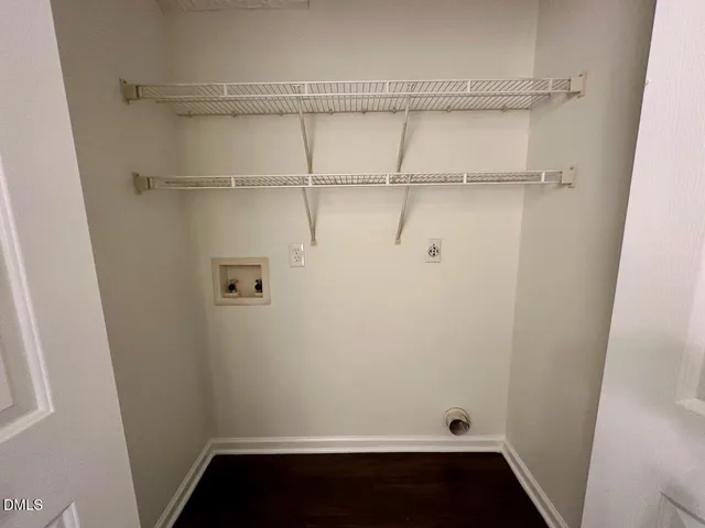 a bathroom with a sink mirror and toilet