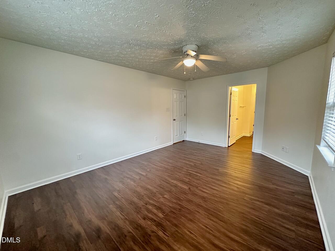 4232 Palafox Court Raleigh, NC 27604 - Photo 16 of 28 an empty room with wooden floor and windows