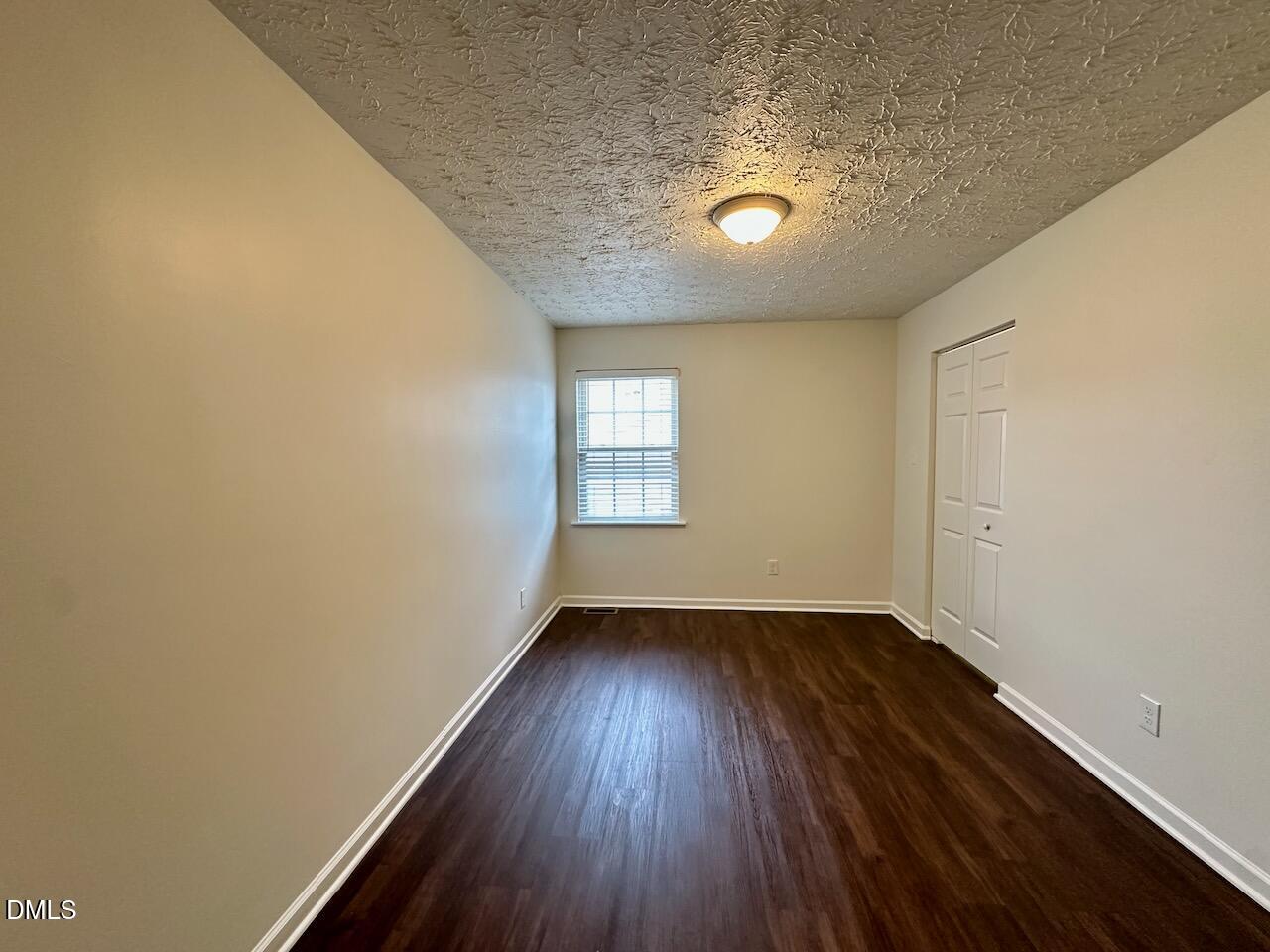 4232 Palafox Court Raleigh, NC 27604 - Photo 20 of 28 an empty room with wooden floor and windows