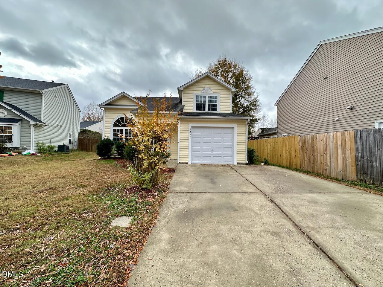 4232 Palafox Court Raleigh, NC 27604 - Photo 2 of 28 a view of a house with a yard and garage