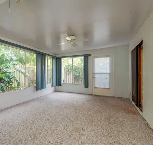 an empty room with windows and view