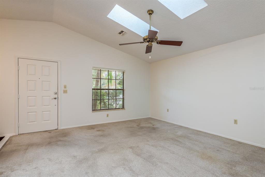 10918 Freemont Drive New Port Richey, FL 34654 - Photo 6 of 26 an empty room with windows