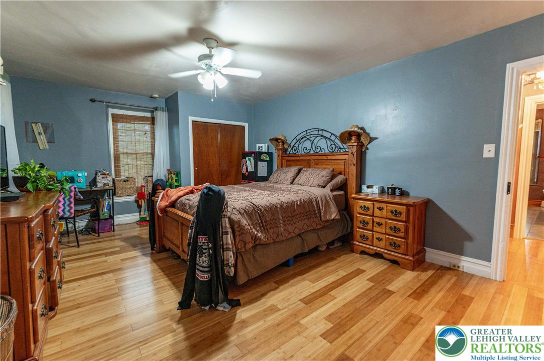 2485 Hieter Road Quakertown, PA 18951 - Photo 43 of 97 Hardwood floors and a ceiling fan create a comfortable atmosphere in this well-appointed bedroom.