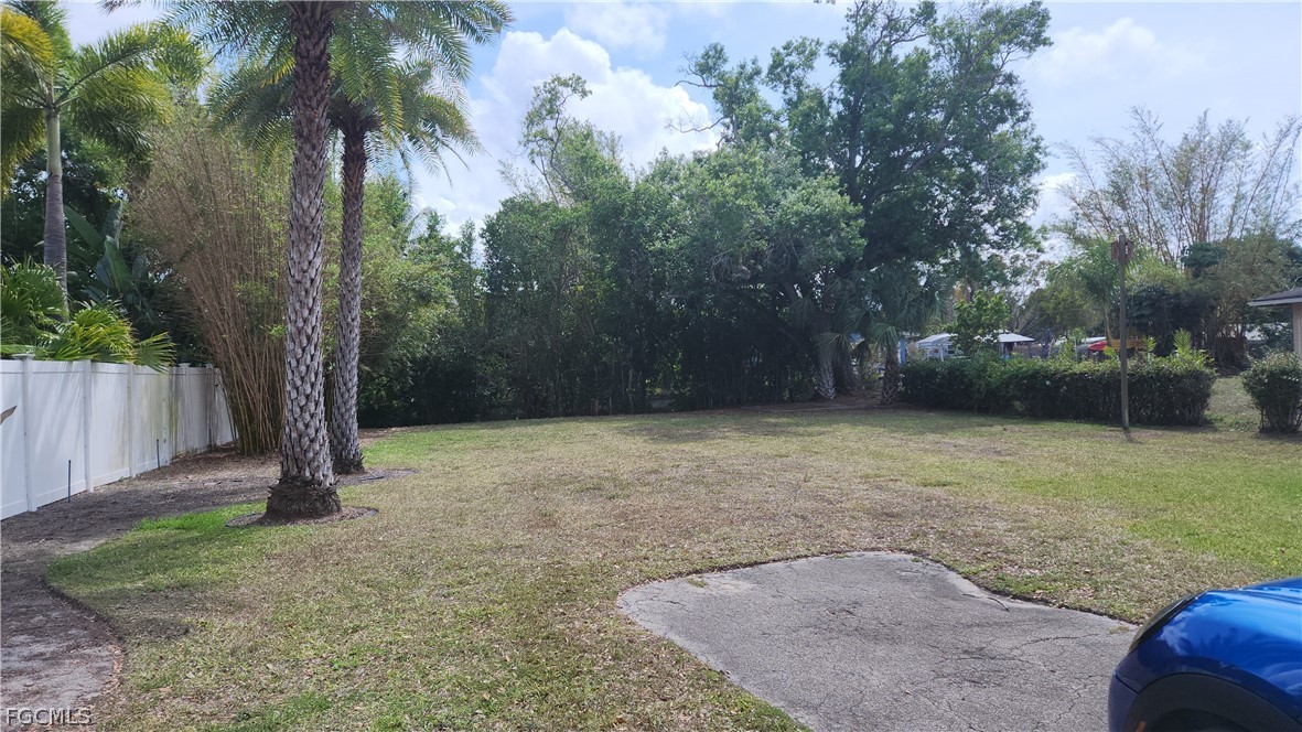 4528 East Riverside Drive Fort Myers, FL 33905 - Photo 1 of 13 a backyard of a house