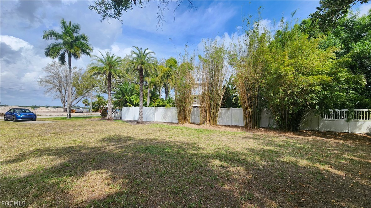 4528 East Riverside Drive Fort Myers, FL 33905 - Photo 11 of 13 a view of a yard with a tree