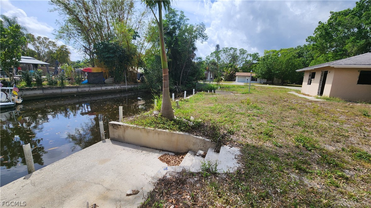 4528 East Riverside Drive Fort Myers, FL 33905 - Photo 9 of 13 a backyard of a house with lots of green space