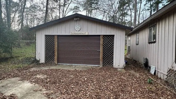 a house with a tree in the back yard