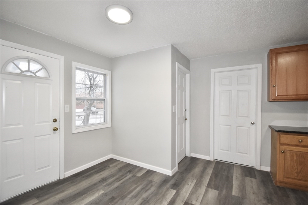 36 Orleans Street Springfield, MA 01109 - Photo 11 of 32 an empty room with windows and closet
