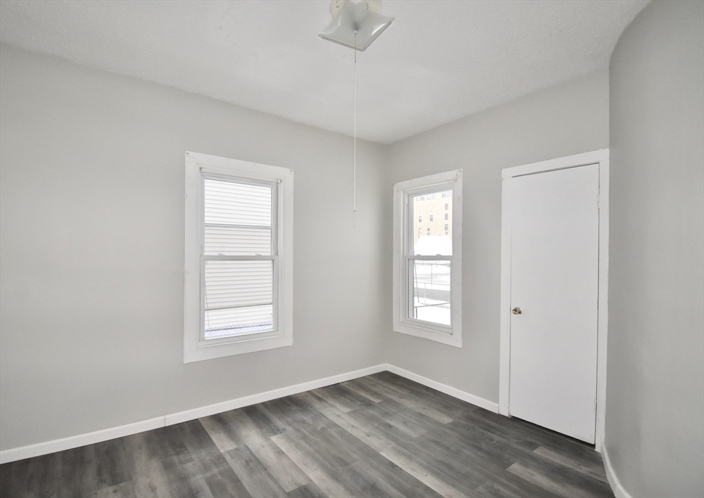 36 Orleans Street Springfield, MA 01109 - Photo 12 of 32 an empty room with windows