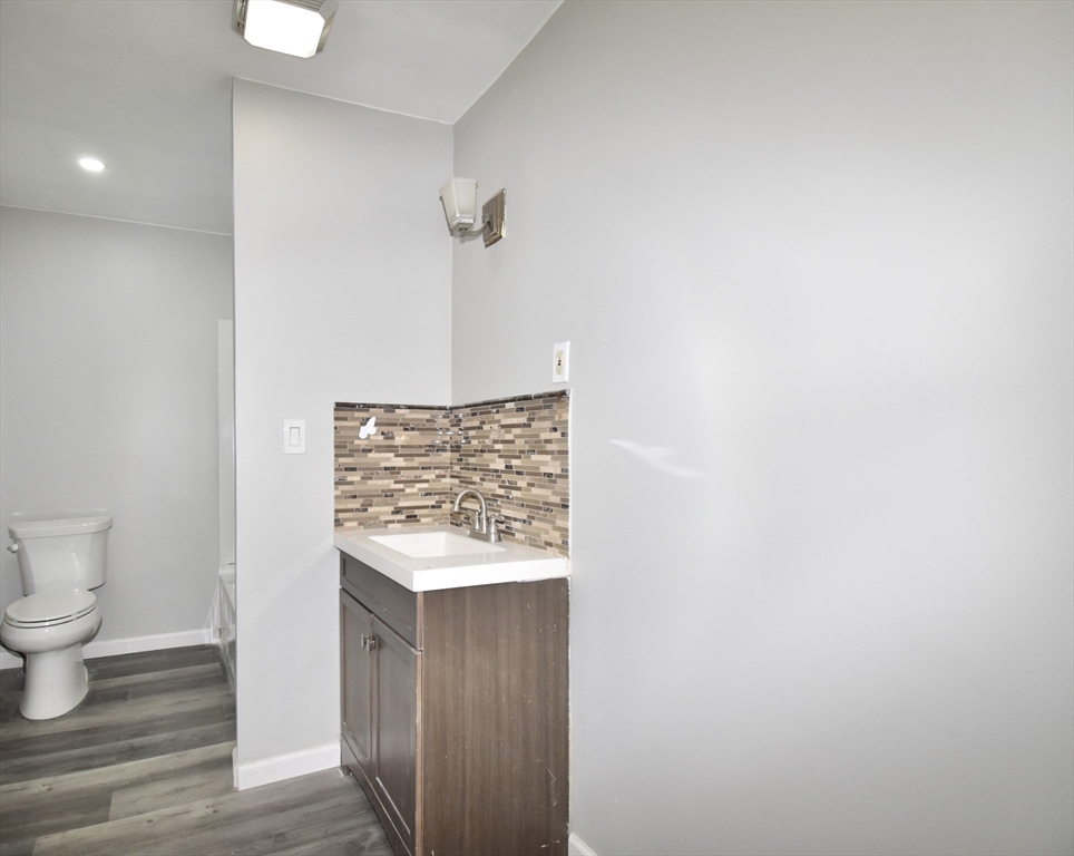 36 Orleans Street Springfield, MA 01109 - Photo 15 of 32 a view of bathroom with a sink and a toilet