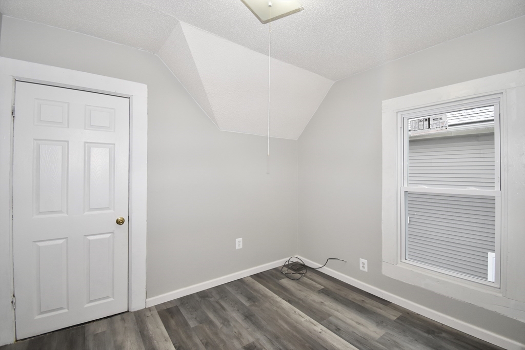 36 Orleans Street Springfield, MA 01109 - Photo 18 of 32 a view of empty room with wooden floor and fan