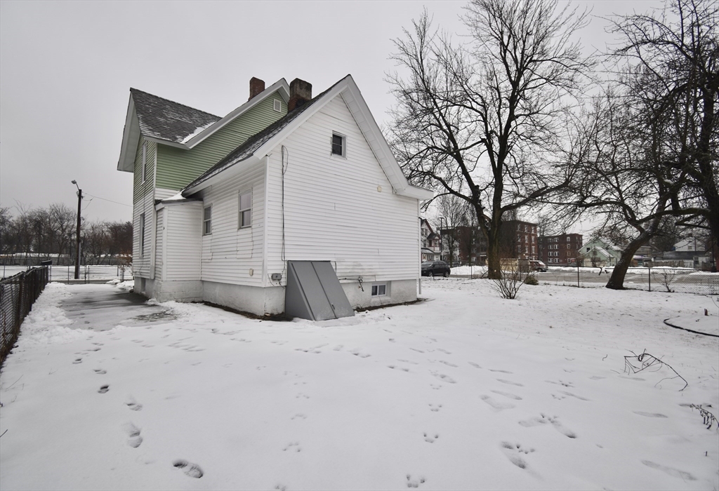 36 Orleans Street Springfield, MA 01109 - Photo 25 of 32 a view of a house with snow on the road