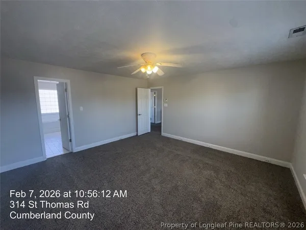 a spacious bathroom with a double vanity sink and a mirror