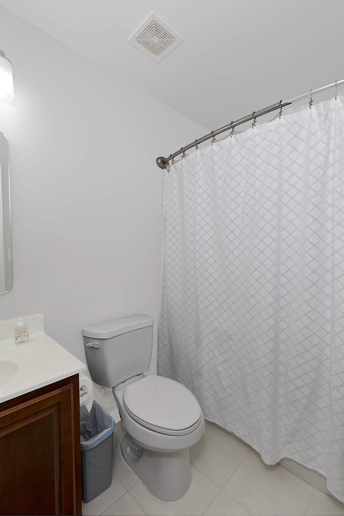 6712 Bridge Way Columbus, GA 31904 - Photo 25 of 36 a white toilet sitting next to a bathroom sink