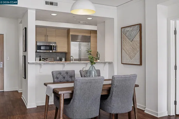 a dining room with furniture and window