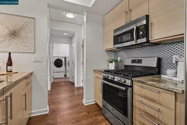 a kitchen with a stove and a microwave