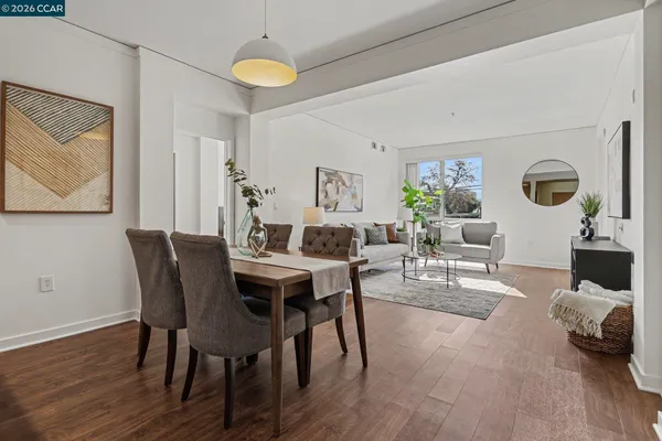 a view of a dining room with furniture and wooden floor