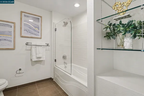 a bathroom with a shower and a bathtub