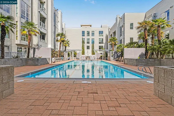 a view of balcony with a swimming pool