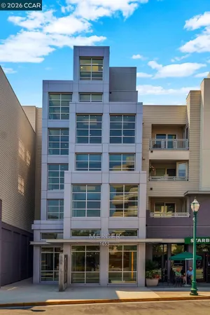 a front view of a building with a street