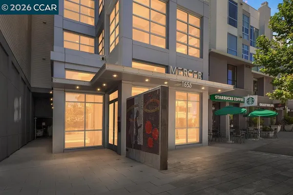 a view of a building with sitting area