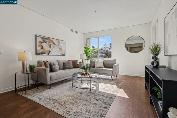 a living room with furniture lamp and rug
