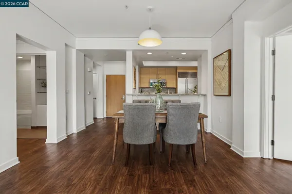 a view of a dining room with furniture window and wooden floor