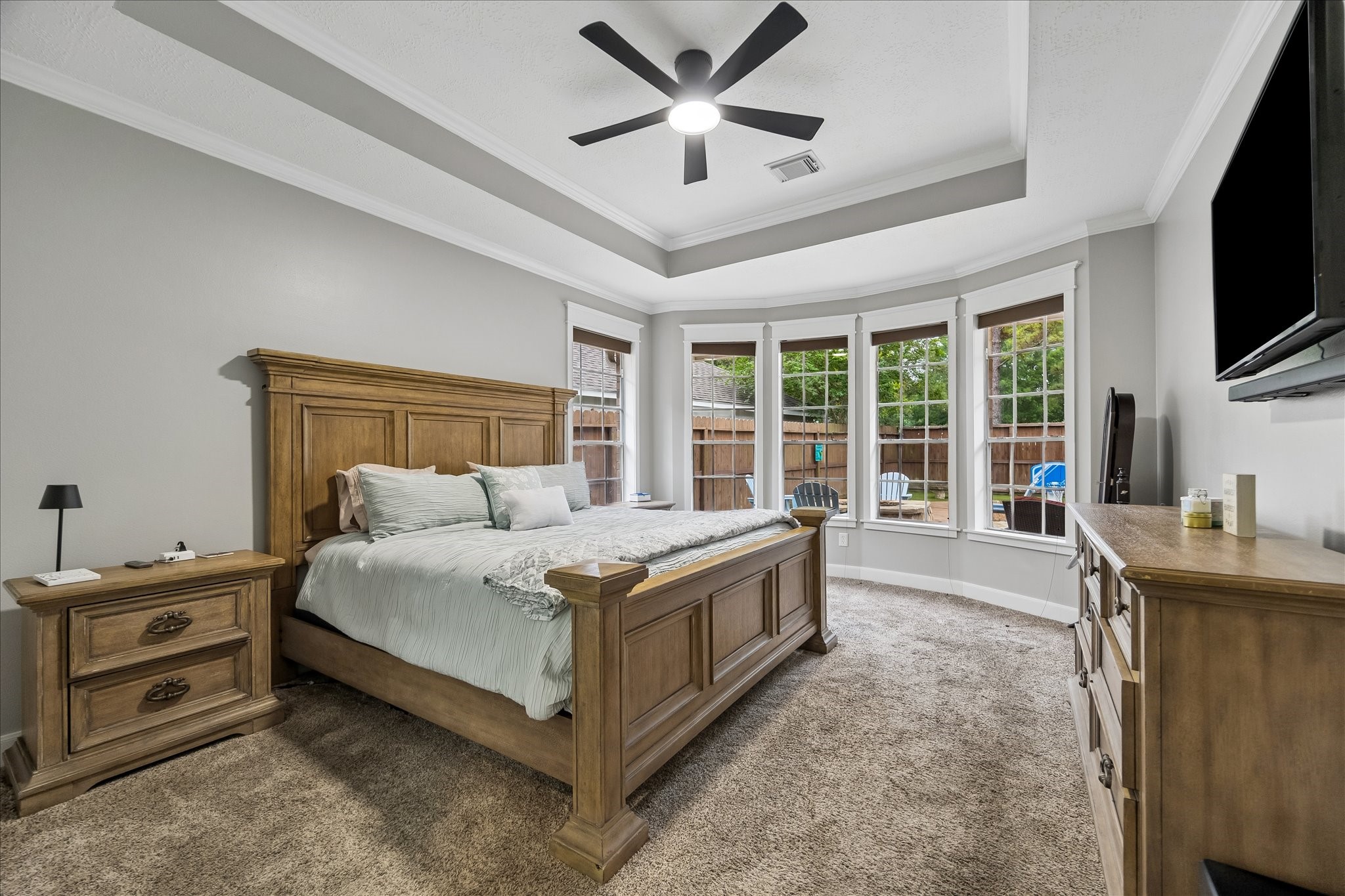 23039 Enchanted Landing Lane Katy, TX 77494 - Photo 18 of 30 a spacious bedroom with a bed and a flat screen tv