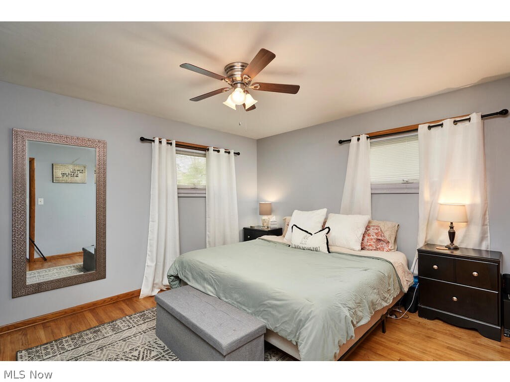 2953 Sweitzer Road Uniontown, OH 44685 - Photo 8 of 14 Bedroom with ceiling fan and light hardwood / wood-style floors