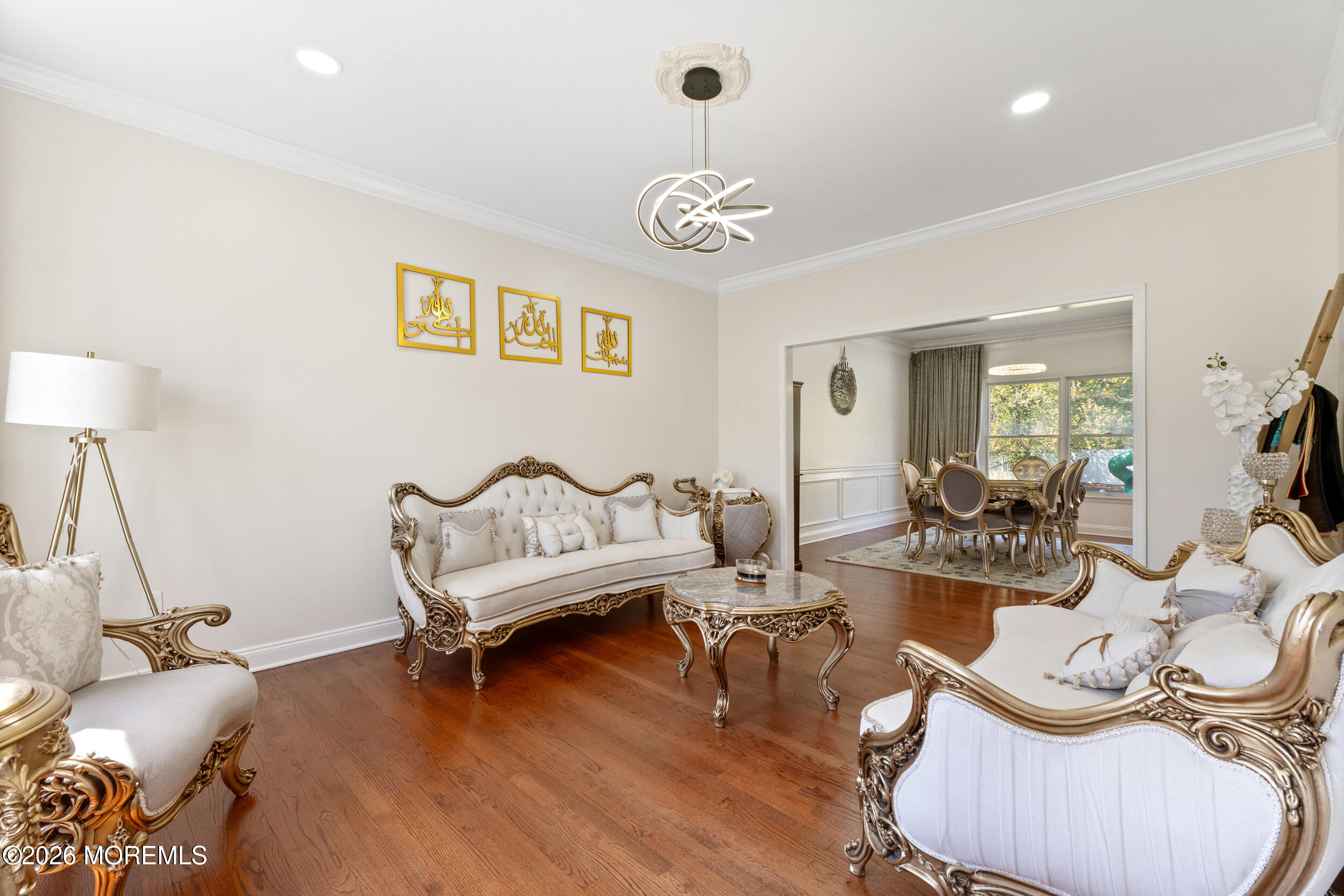 104 Autumn Road Matawan, NJ 07747 - Photo 9 of 64 a living room with furniture a table and a flat screen tv