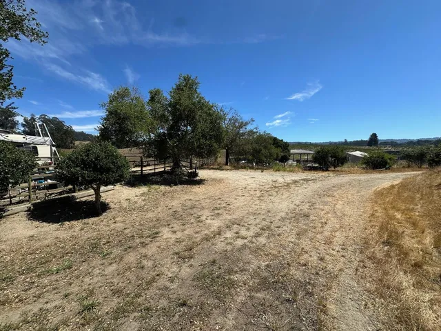 a view of outdoor space with deck and yard