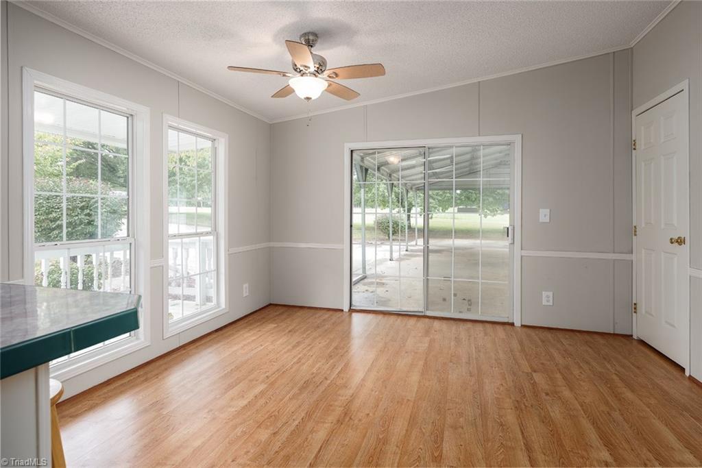 411 Apple Road Reidsville, NC 27320 - Photo 12 of 48 Light and bright Breakfast area with sliding glass door to the attached 3 car carport
