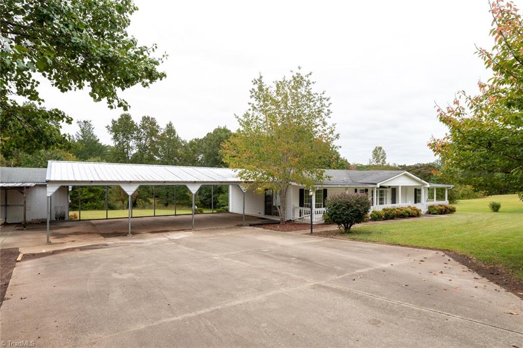 411 Apple Road Reidsville, NC 27320 - Photo 37 of 48 In addition to the 3 car attached and 2 car detached carports, there is ample parking in the driveway