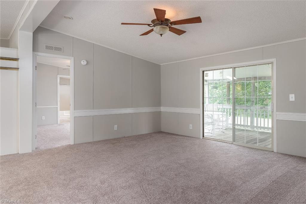 411 Apple Road Reidsville, NC 27320 - Photo 4 of 48 Living Room with view to the Master Bedroom. Living Room, Dining Room and Master are all newly carpeted and the entire interior has new, neutral paint.