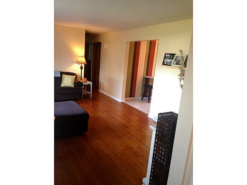 Living Room. Gorgeous hard wood floors and very spacious.