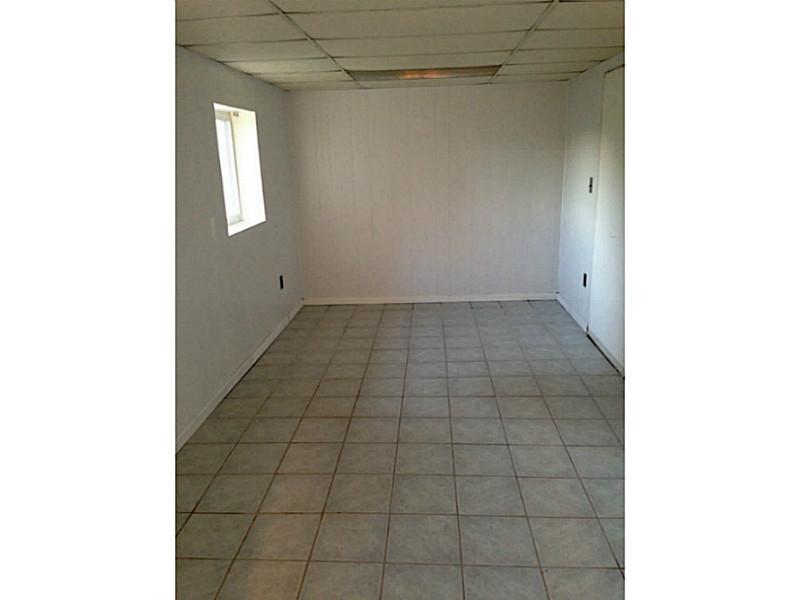 Den. Bonus room off of dining room out back.