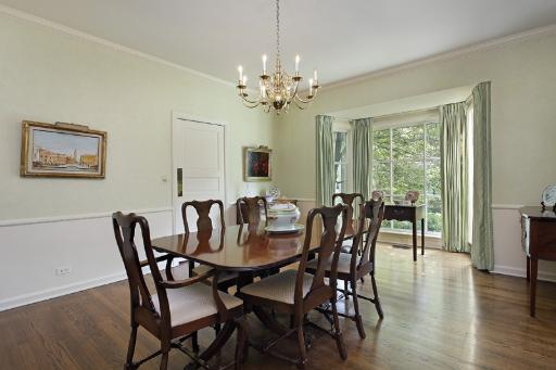 523 Sheridan Road Kenilworth, IL 60043 - Photo 3 of 9 a view of a dining room with furniture window and wooden floor
