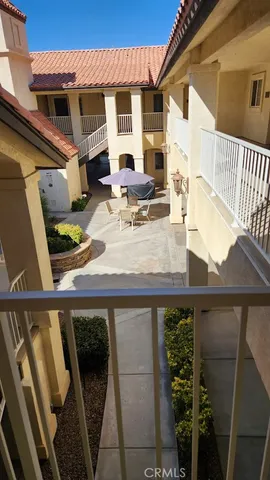 a view of outdoor kitchen with seating area
