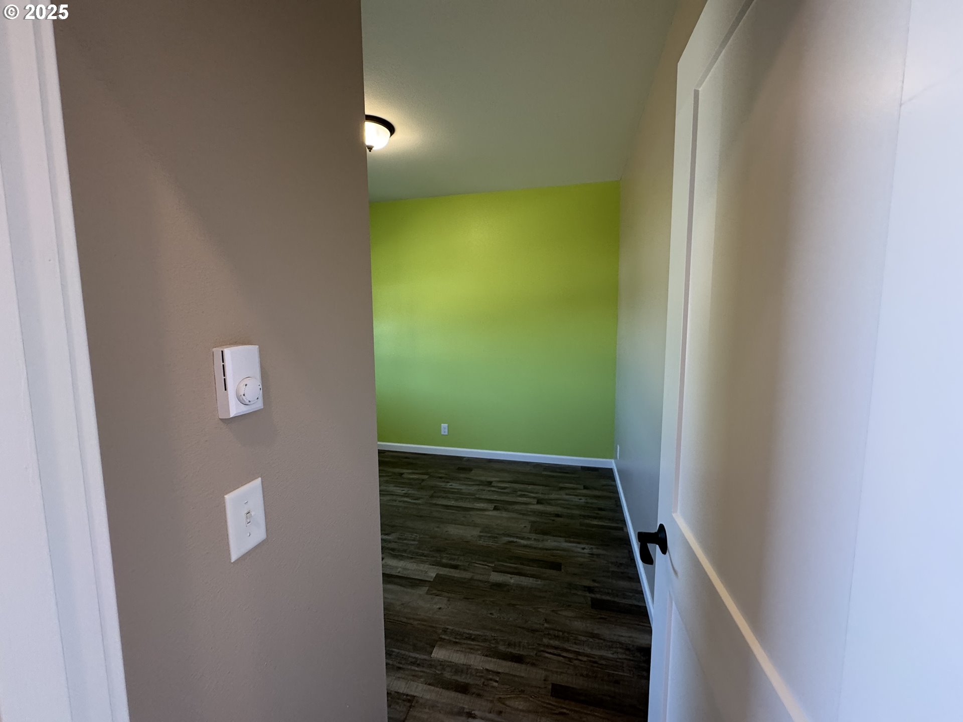 1966 34th Street Florence, OR 97439 - Photo 15 of 30 a view of an empty room with wooden floor