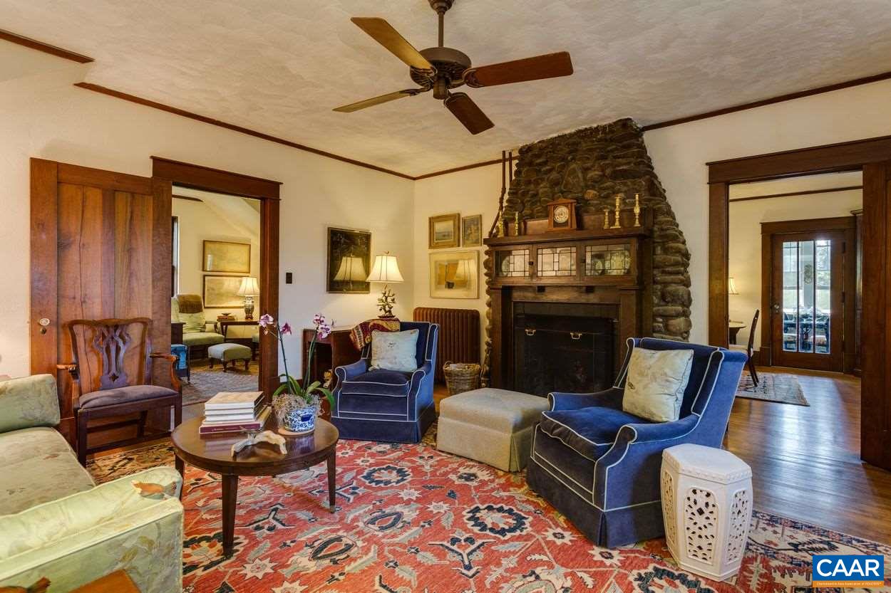 3211 Lowesville Road Roseland, VA 22967 - Photo 13 of 48 a living room with furniture a fireplace and a chandelier