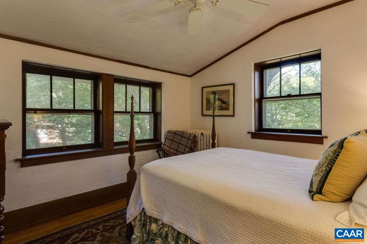 3211 Lowesville Road Roseland, VA 22967 - Photo 24 of 48 a bedroom with a large bed and a window