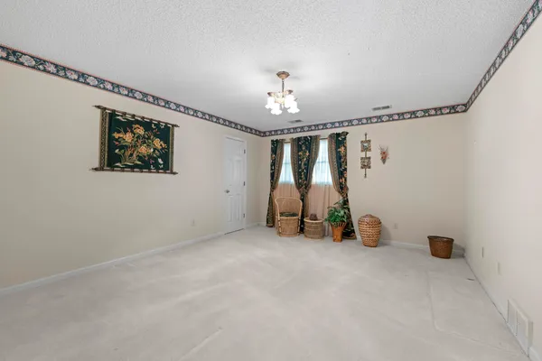 a view of room with gym equipment