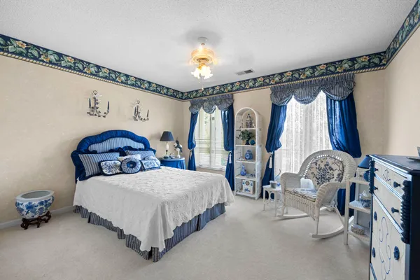 a bedroom with bed and a window