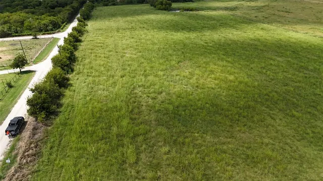 a view of a lake and a large yard