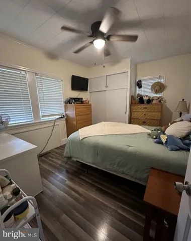 a bedroom with a bed and a television