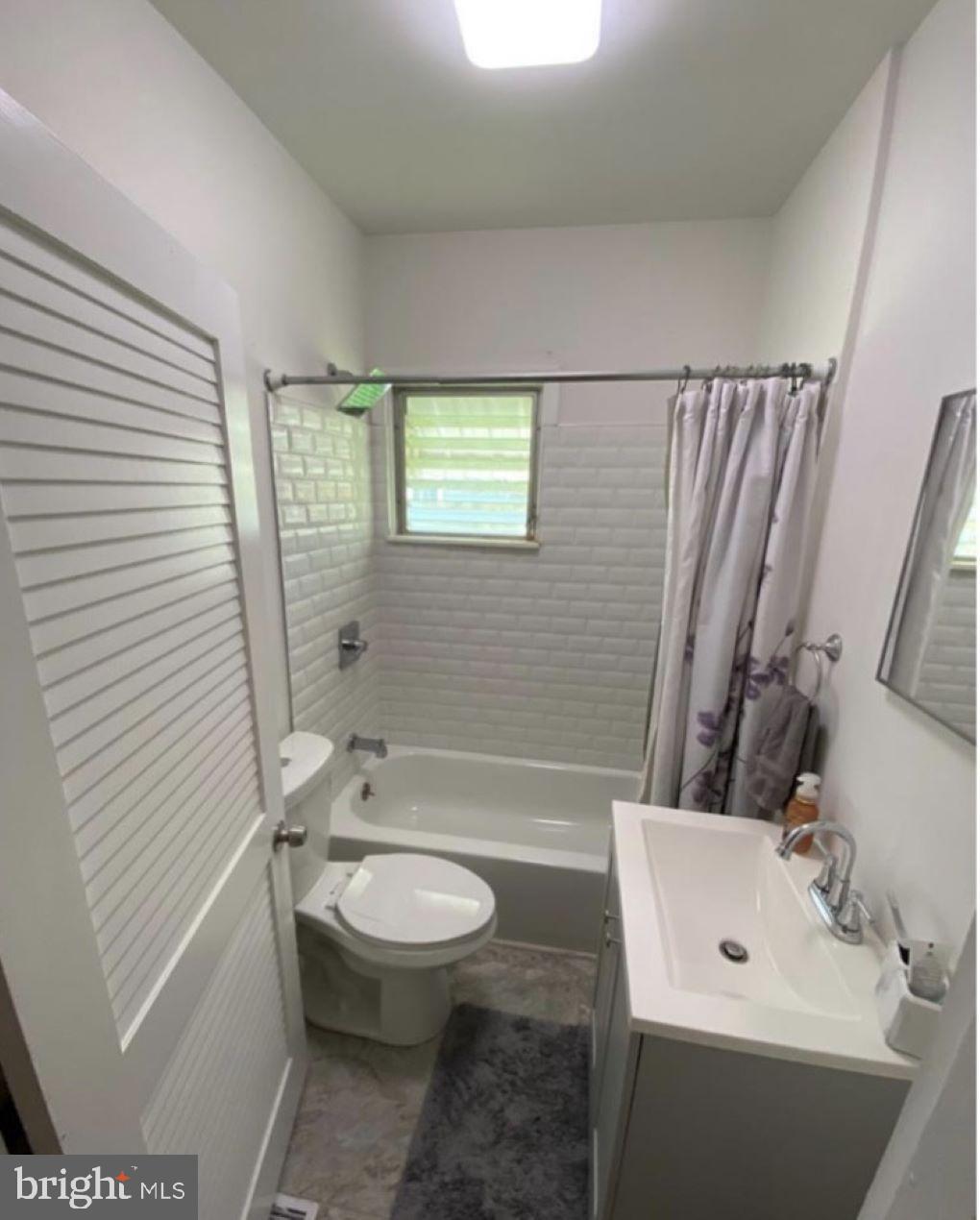 409 Myrtle Street Crisfield, MD 21817 - Photo 15 of 19 a bathroom with a sink a toilet and shower