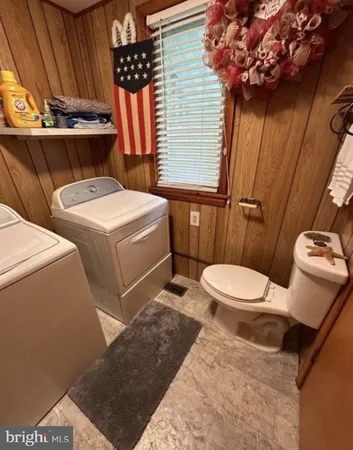 a view of house with backyard