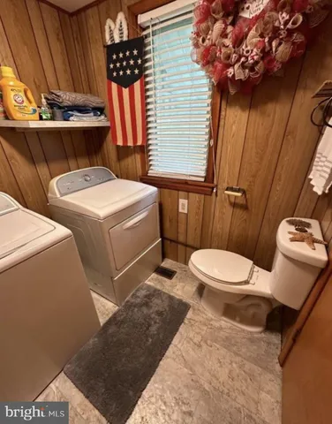 a view of house with backyard